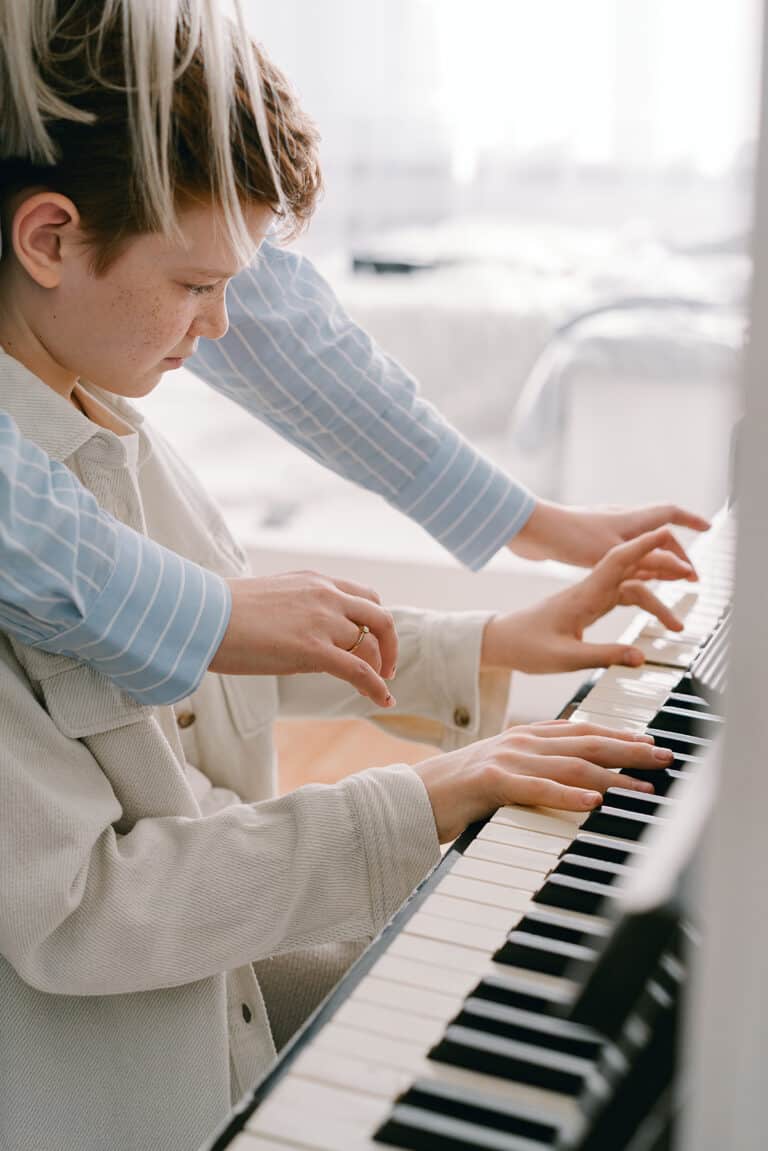 young boy taking in home piano lessons